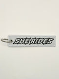 She Rides keychain black