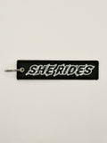 She Rides keychain white