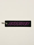 She Rides keychain purple